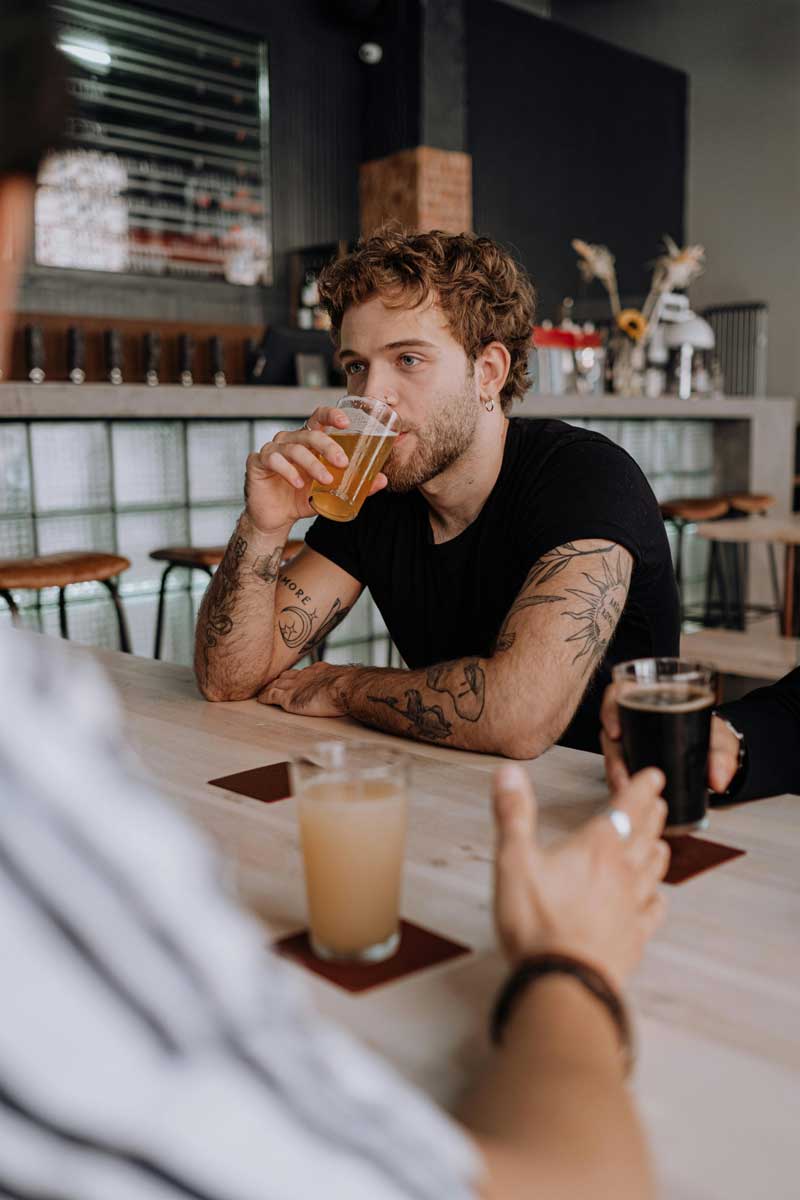 A man tasting craft beers during a tour of Alchemy Street Brewing and Tap RoomTour